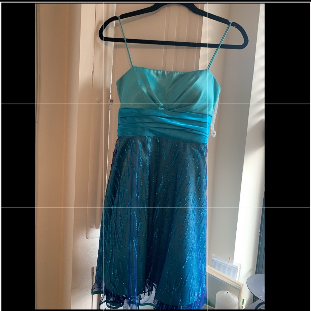 Gorgeous teal dress with satin top and glittery bottom and spaghetti straps